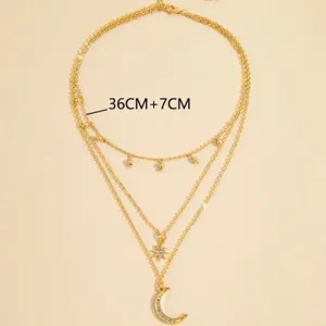 Collana dorata a strati con pendenti a stella e luna crescente con strass donna