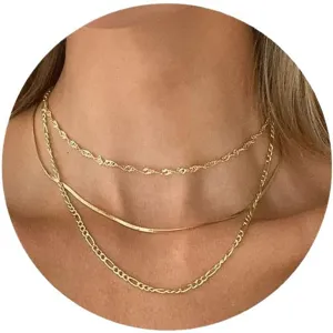 Layered gold necklace set with twist, snake, and Figaro chain styles for hip-hop style