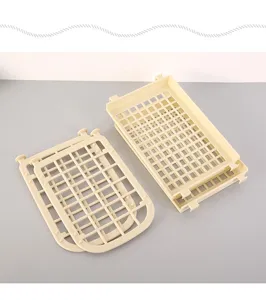 Close-up of beige plastic storage rack parts with a hollow grid for home organization.