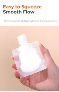 Close-up of hand holding a frosted squeeze pouch filled with white lotion for travel