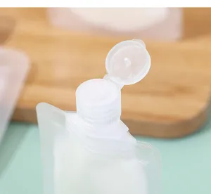 Detailed macro view of the white flip-top cap on a portable travel liquid pouch