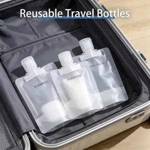 Refillable leak-proof travel squeeze pouches for shampoo and toiletries in suitcase