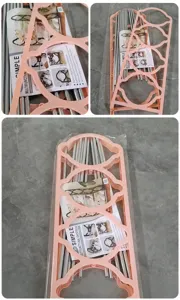Nicht montierte Teile eines rosa 4-stufigen Schuhregals in der Originalverpackung