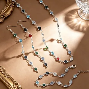 Detailed view of colorful stone jewelry set including necklace, earrings and bracelet.