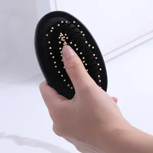 Ergonomic black anti-static air cushion hairbrush with massage bristles for daily styling
