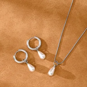 Elegant silver pearl jewelry set with teardrop pendant necklace and hoop earrings