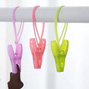 Set of 12 durable windproof plastic clothes drying clips in assorted pastel colors