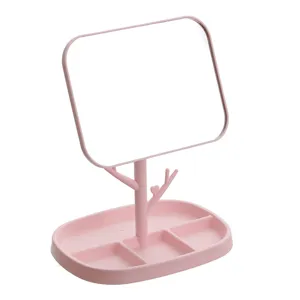 Elegant pink desktop makeup mirror with tree-shaped stand and jewelry storage base