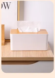 Close-up of minimalist tissue box with natural bamboo lid and white body