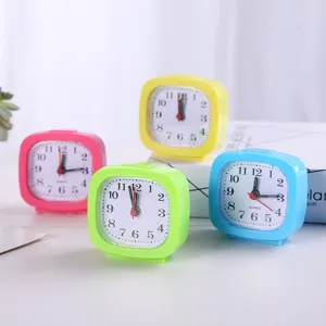 Set of colorful candy-colored square analog alarm clocks for kids bedside or office desk