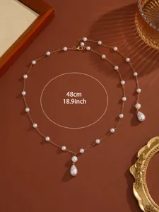 Elegant gypsophila pearl tassel necklace with 48cm gold chain and teardrop pendant detail