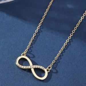 Collar minimalista con colgante de símbolo de infinito dorado y piedras.