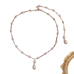 Elegant pearl star tassel necklace with pinkish waterdrop pendants on gold chain