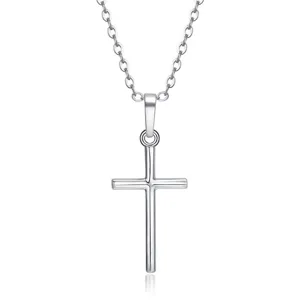 Close-up detail of a sleek silver-colored cross pendant necklace on a minimalist link chain.
