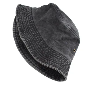 Detailed view of a washed denim bucket hat with vintage texture and stitched brim.