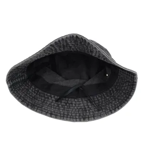 Detailed inside view of a washed denim bucket hat with an adjustable inner drawstring