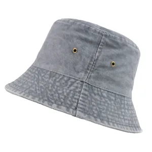 Close-up of washed grey denim bucket hat showing metal eyelets and stitching texture.
