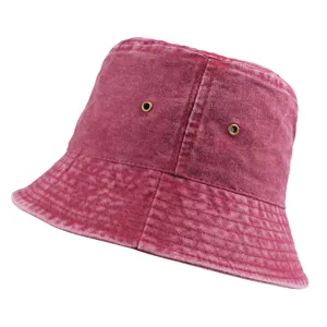 Close-up view of a professional wine red washed denim bucket hat with metal ventilation eyelets