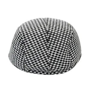 Detailed rear view of a classic black and white houndstooth woolen newsboy cap for men