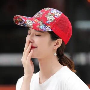 Close-up detail of a stylish red floral print mesh baseball cap for women's outdoor wear.