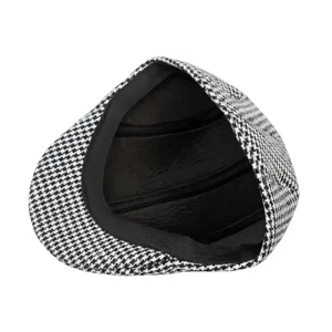 Detailed inside view of a classic houndstooth beret showing black lining and elastic band
