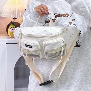 White water-repellent nylon chest bag detail showing front pockets and star patterns