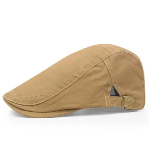 Side profile view of a khaki cotton flat cap with a vintage brass adjustment buckle