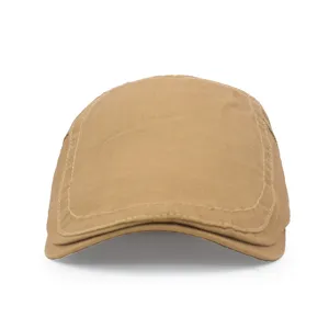 Front view detail of a classic khaki cotton flat cap with visible seam stitching details