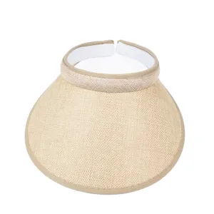 Detail view of a beige straw-texture summer sun visor with a white inner lining