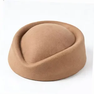 Close-up of a vintage brown felt pillbox stewardess hat showing smooth texture