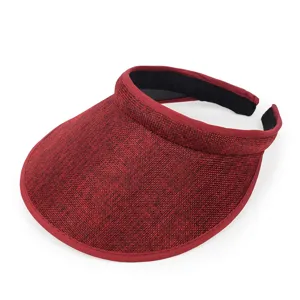 Detail view of red woven cotton-linen sun visor hat with wide brim for summer beach