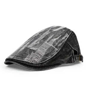 Side view of a vintage distressed denim flat cap with ripped texture details