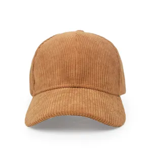 Macro view of the rich ribbed texture on this brown corduroy baseball cap with a curved brim.