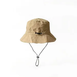 Detail view of a khaki quick-dry waterproof bucket hat with an adjustable chin strap for outdoors.