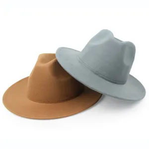 Solid color felt fedora hats in brown and grey with wide flat brims for men and women