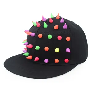 Detail view of black snapback hat with multi-colored punk style cone spikes