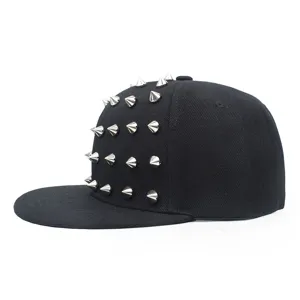 Side view detail of a black snapback hip-hop hat with silver metallic studs.