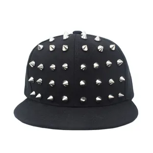 Close-up of black hip-hop snapback hat with metallic silver cone studs detailing.