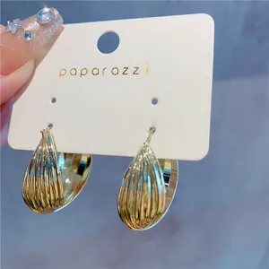 Detailed view of gold multi-layer hoop earrings with elegant exaggerated design