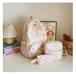 Stylish 3-piece cream backpack set featuring pink bow patterns for college students