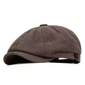 Detailed view of the herringbone wool texture on a classic retro newsboy cap