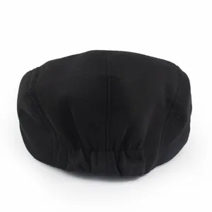 Rear view detail of a classic black newsboy flat cap featuring comfortable elastic band
