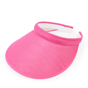 Detailed macro view of a vibrant pink mesh sun visor hat for summer beach and outdoor use