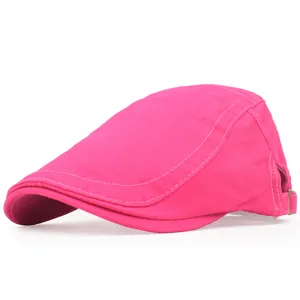 Detailed side view of a vibrant pink cotton beret cap with an adjustable back strap
