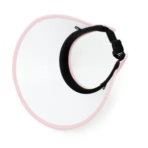 Detailed overhead view of the adjustable strap on a pink and white women's sun visor hat