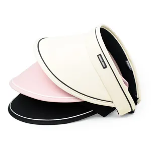 Detailed view of three colorful women's summer sun visors with wide brims for UV protection