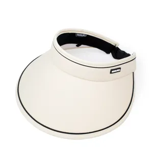 Detailed macro shot of women's beige UV protection sun visor hat with a wide brim