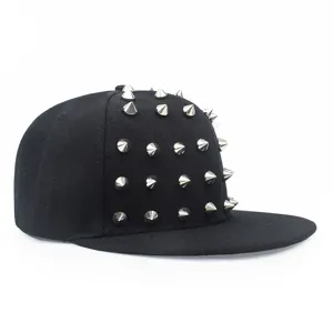 Close-up of black hip hop snapback cap decorated with silver metallic cone studs