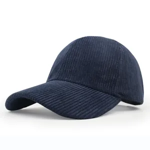 Detailed side view of a navy blue corduroy baseball cap with a classic curved brim design
