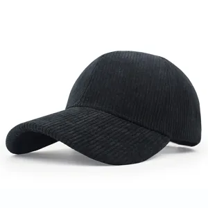 Detailed side view of a premium black corduroy baseball cap with a classic curved brim.